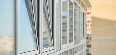 PVC windows on facade of skyscraper. Plastic double glazed windows. Building exterior.